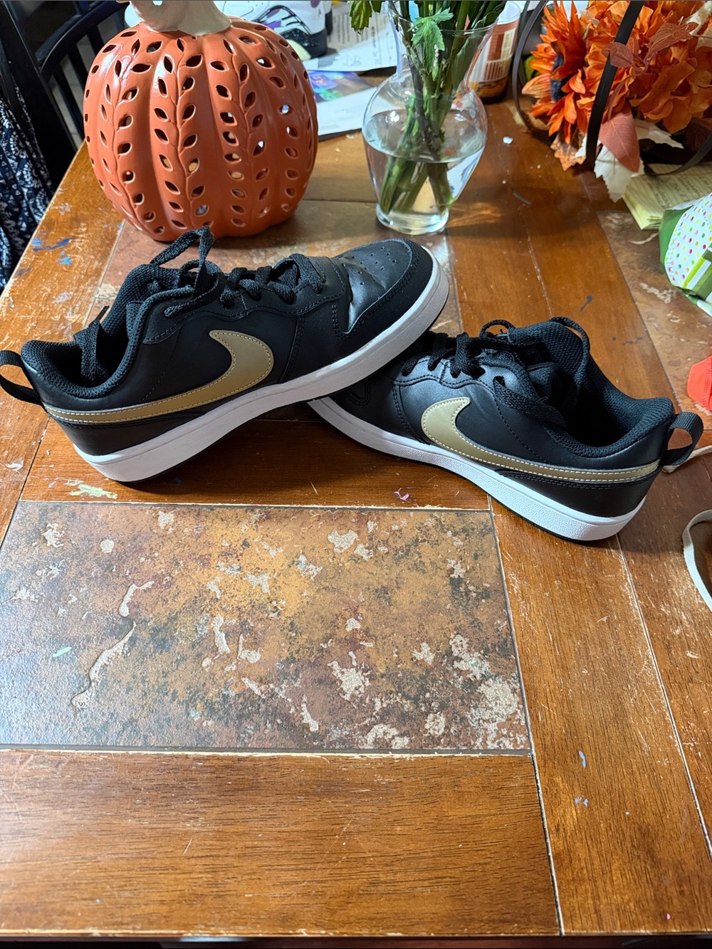 Nike Kids Black Sneakers with Gold Swoosh